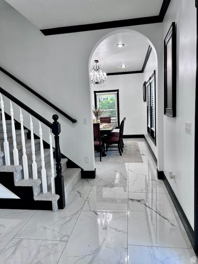 4433 Devonshire Dr W, Bountiful, UT 84010 - staircase featuring arched walkways, ornamental molding, baseboards, and marble tiled flooring