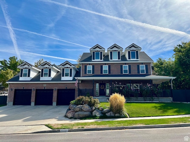 4433 Devonshire Dr W, Bountiful, UT 84010 - view of front facade with covered porch, an attached garage, brick siding, and driveway