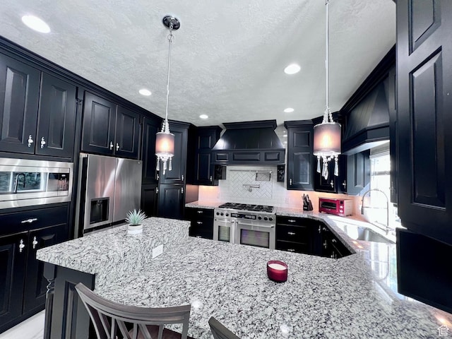 4433 Devonshire Dr W, Bountiful, UT 84010 - kitchen with appliances with stainless steel finishes, a sink, light stone counters, tasteful backsplash, and dark cabinets