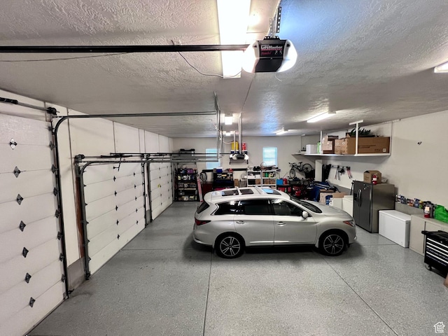4433 Devonshire Dr W, Bountiful, UT 84010 - garage with a garage door opener and black fridge with ice dispenser