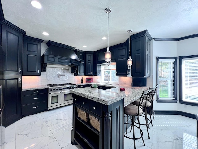 4433 Devonshire Dr W, Bountiful, UT 84010 - kitchen featuring range with two ovens, light marble finish floors, custom range hood, backsplash, and a textured ceiling