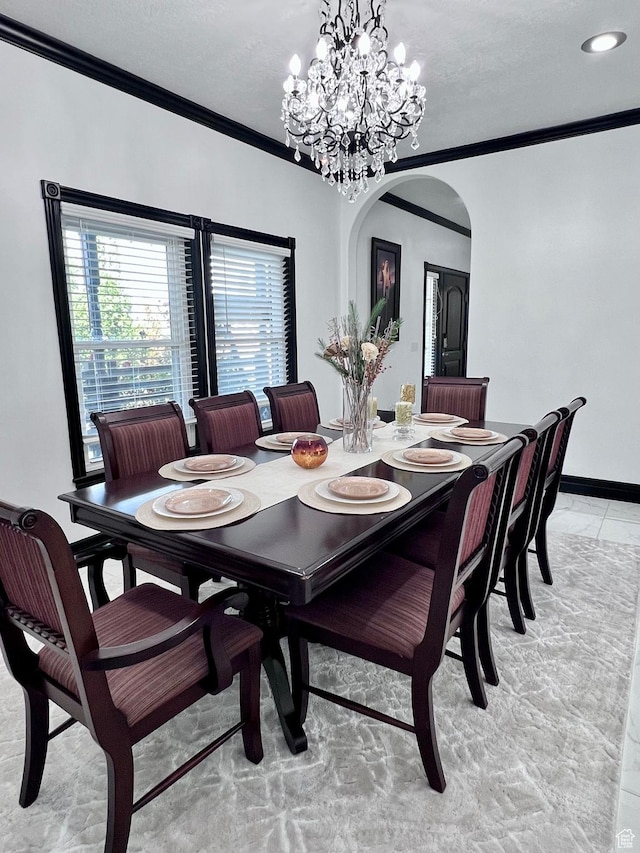 4433 Devonshire Dr W, Bountiful, UT 84010 - dining space featuring arched walkways, crown molding, a chandelier, and baseboards