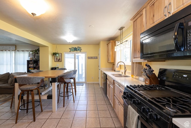 1250 N Lewis Peak Dr, Ogden, UT 84404 - kitchen featuring black appliances, a sink, light countertops, and plenty of natural light