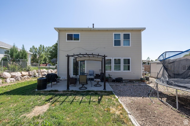1250 N Lewis Peak Dr, Ogden, UT 84404 - rear view of house featuring a trampoline, a patio area, and a pergola