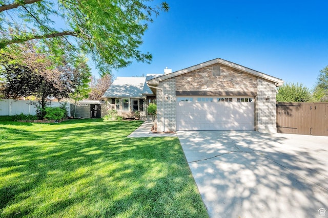 6767 S 1600 W, West Jordan, UT 84084 - view of front of property with driveway, an attached garage, brick siding, and a gate