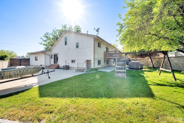 6767 S 1600 W, West Jordan, UT 84084 - back of property with a patio area, a wooden deck, and cooling unit