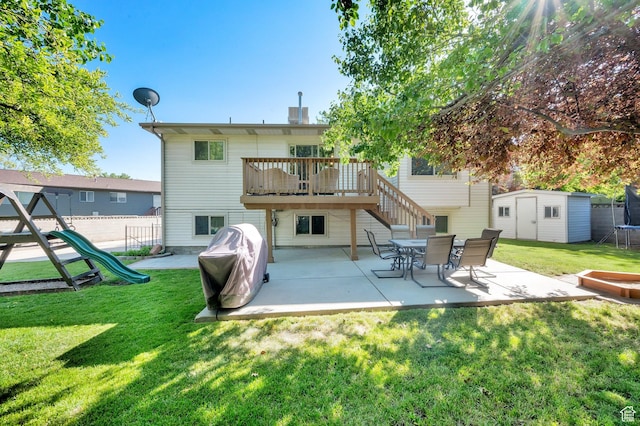 6767 S 1600 W, West Jordan, UT 84084 - back of property with a patio, a playground, and a deck