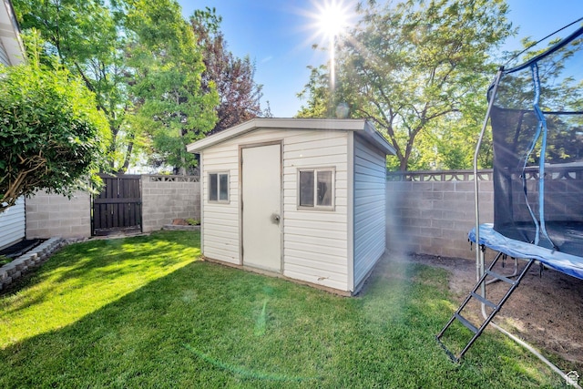 6767 S 1600 W, West Jordan, UT 84084 - view of shed featuring a trampoline and a gate