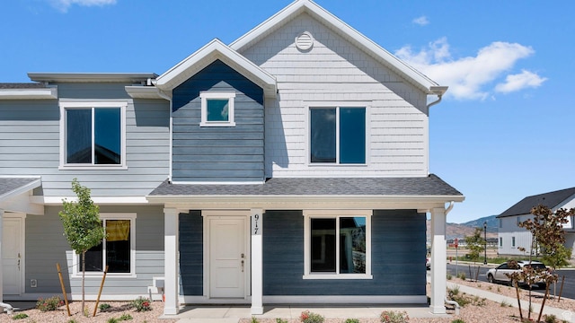 104 N Kelp Ln Unit 2310, Saratoga Springs, UT 84045 - view of front facade with covered porch and roof with shingles