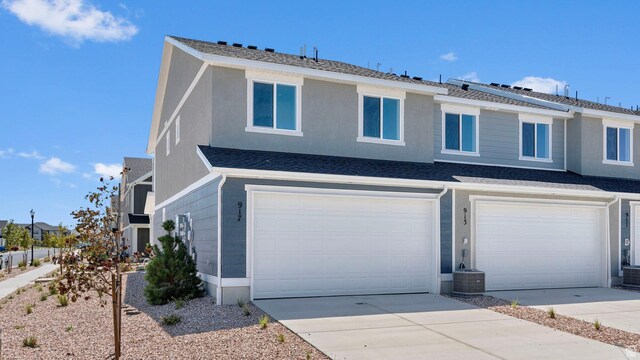 104 N Kelp Ln Unit 2310, Saratoga Springs, UT 84045 - view of front of house featuring a garage, driveway, and central AC