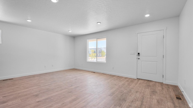 104 N Kelp Ln Unit 2310, Saratoga Springs, UT 84045 - spare room featuring light wood-type flooring, recessed lighting, and baseboards