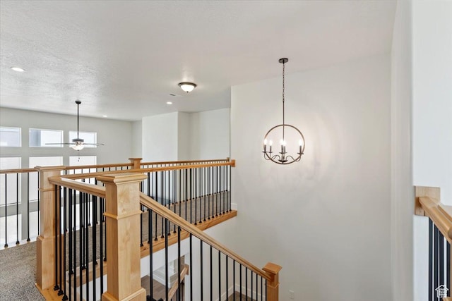 1046 W Seasons View Ct, Lehi, UT 84043 - corridor with an upstairs landing, a chandelier, recessed lighting, carpet, and a textured ceiling
