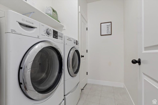 1046 W Seasons View Ct, Lehi, UT 84043 - washroom featuring washer and clothes dryer, baseboards, and light tile patterned floors