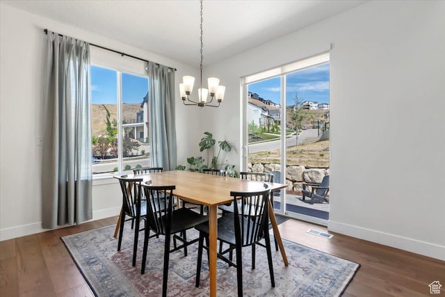 1046 W Seasons View Ct, Lehi, UT 84043 - dining space featuring a chandelier, baseboards, and dark wood-style floors