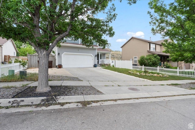 7265 N Ute Dr, Eagle Mountain, UT 84005 - view of front facade with concrete driveway and an attached garage