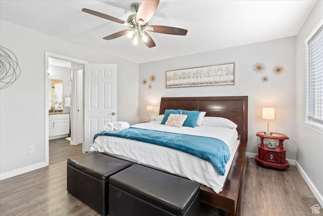 7265 N Ute Dr, Eagle Mountain, UT 84005 - bedroom with wood finished floors, baseboards, ensuite bathroom, and ceiling fan