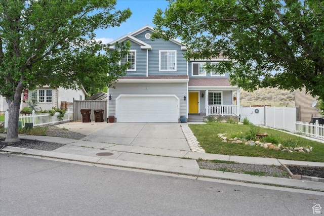 7265 N Ute Dr, Eagle Mountain, UT 84005 - traditional home with covered porch, an attached garage, and driveway