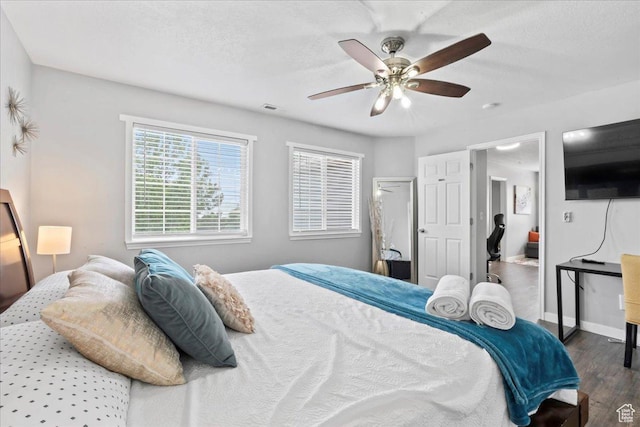 7265 N Ute Dr, Eagle Mountain, UT 84005 - bedroom with wood finished floors, ceiling fan, and baseboards
