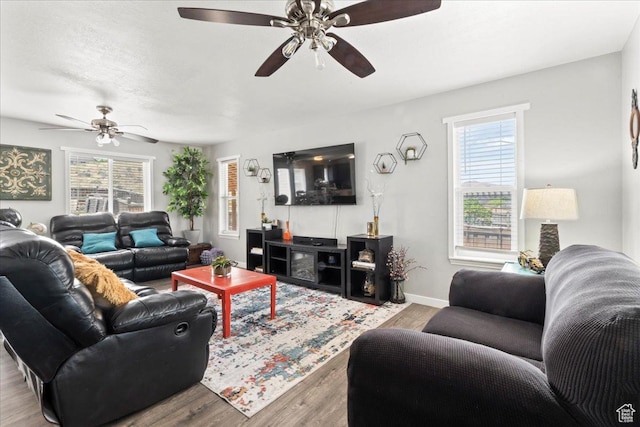 7265 N Ute Dr, Eagle Mountain, UT 84005 - living room with ceiling fan, plenty of natural light, and wood finished floors
