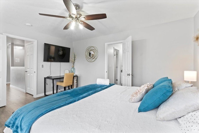 7265 N Ute Dr, Eagle Mountain, UT 84005 - bedroom with wood finished floors, baseboards, and ceiling fan