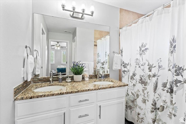 7265 N Ute Dr, Eagle Mountain, UT 84005 - full bath featuring double vanity, a shower with shower curtain, and ceiling fan