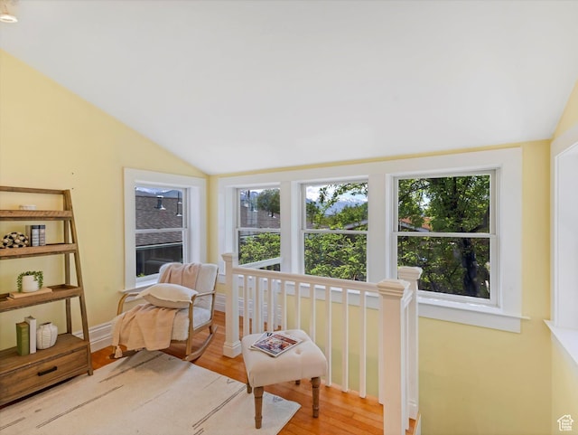 218 E Fifth Ave, Salt Lake City, UT 84103 - sitting room featuring lofted ceiling, healthy amount of natural light, an upstairs landing, and wood finished floors