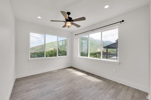 2279 E Ravine Rock Way, Draper, UT 84020 - unfurnished room featuring baseboards, light wood-style flooring, a ceiling fan, and recessed lighting