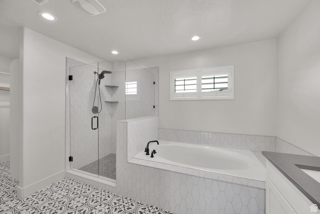 2279 E Ravine Rock Way, Draper, UT 84020 - full bath with a garden tub, a shower stall, tile patterned flooring, recessed lighting, and vanity