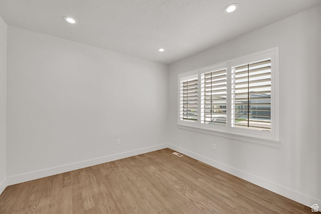 2279 E Ravine Rock Way, Draper, UT 84020 - spare room with baseboards, recessed lighting, and wood finished floors