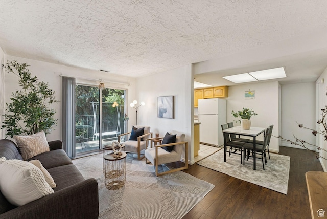 1044 E Quail Park Dr S Unit C, Millcreek, UT 84117 - living room featuring hardwood / wood-style flooring, a skylight, and a textured ceiling