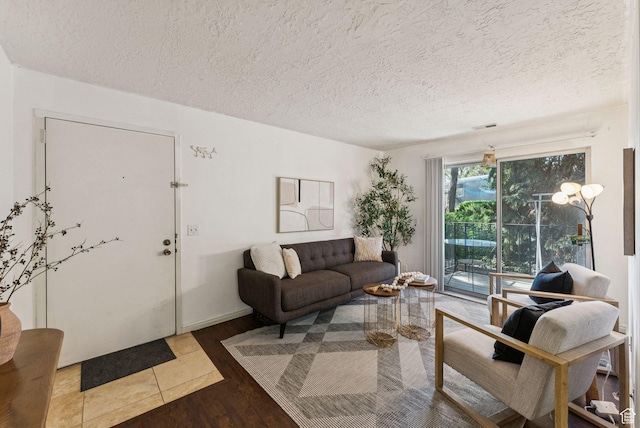 1044 E Quail Park Dr S Unit C, Millcreek, UT 84117 - living area with wood finished floors and a textured ceiling