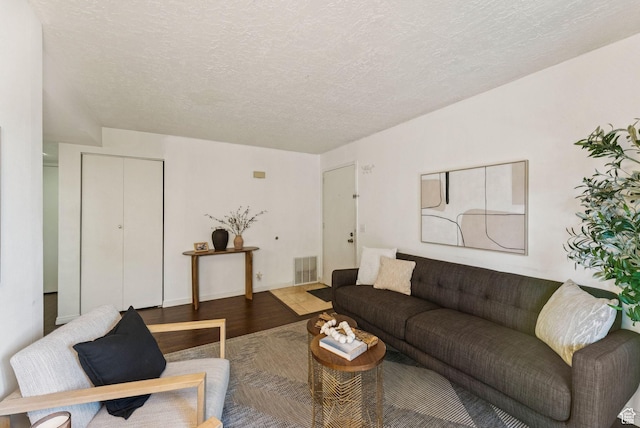 1044 E Quail Park Dr S Unit C, Millcreek, UT 84117 - living room with wood finished floors and a textured ceiling