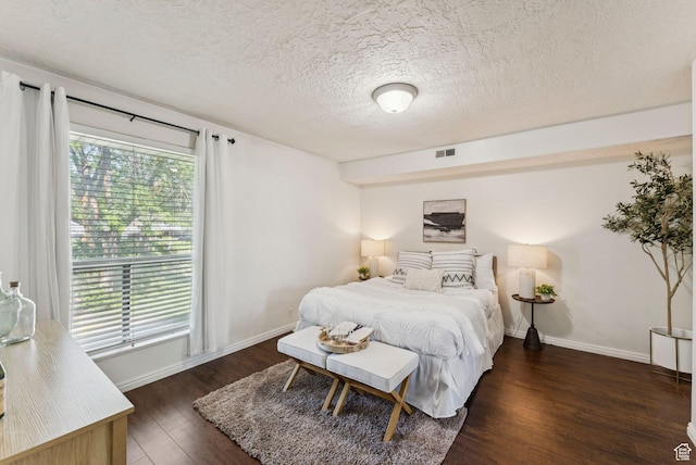 1044 E Quail Park Dr S Unit C, Millcreek, UT 84117 - bedroom featuring wood finished floors, a textured ceiling, and baseboards