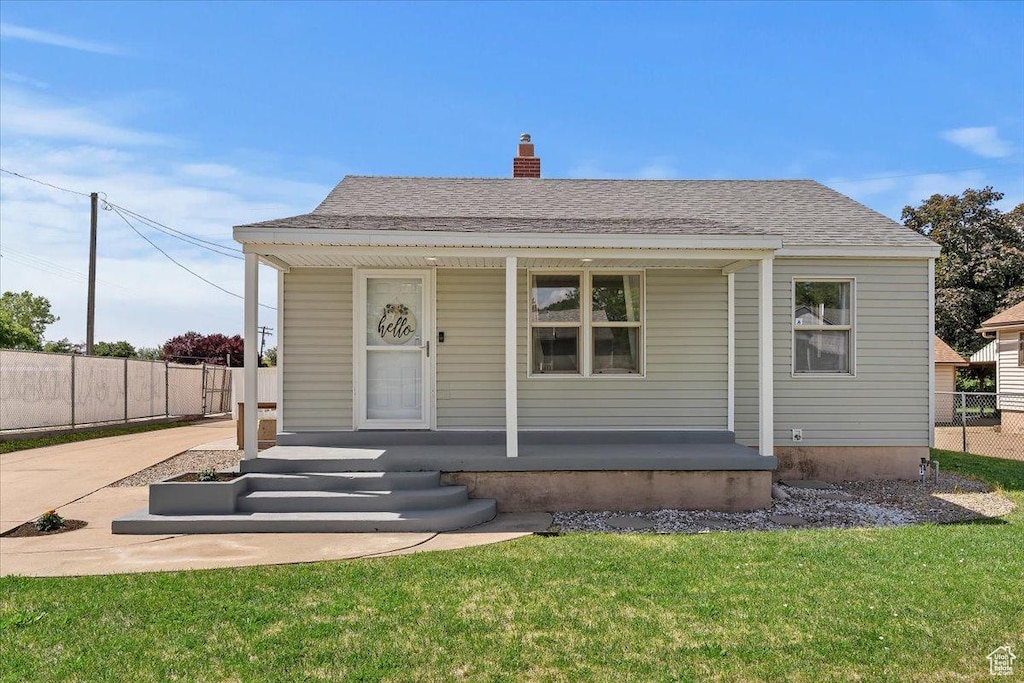 990 E 1000 S, Clearfield, UT 84015 - bungalow-style house featuring a porch and a chimney