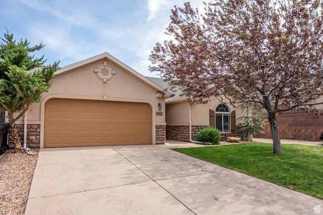 1447 S Southern View Dr, Cedar City, UT 84720 - view of front of home featuring stone siding, stucco siding, driveway, and an attached garage
