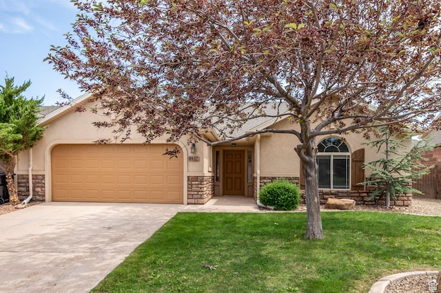 1447 S Southern View Dr, Cedar City, UT 84720 - view of front facade featuring stone siding, stucco siding, a garage, driveway, and a front yard