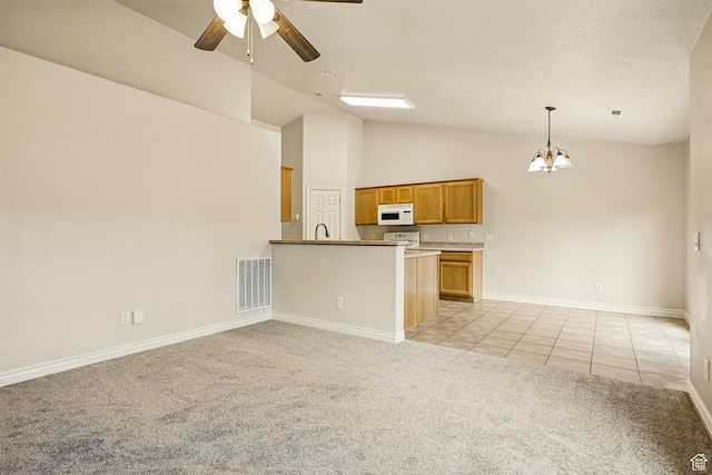 1447 S Southern View Dr, Cedar City, UT 84720 - kitchen featuring white microwave, light colored carpet, a ceiling fan, a chandelier, and light tile patterned flooring