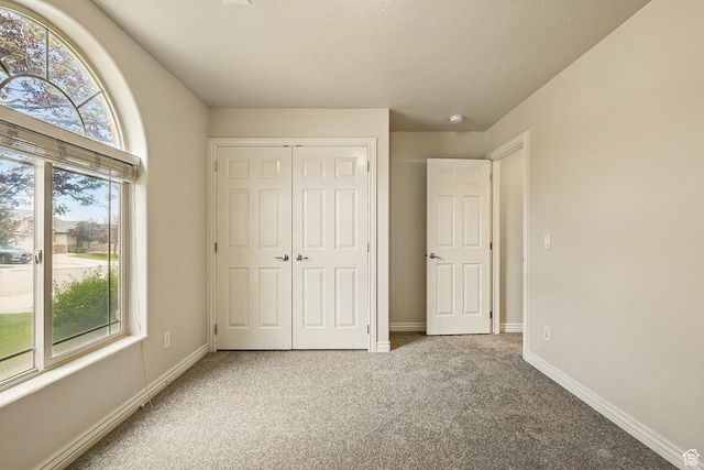 1447 S Southern View Dr, Cedar City, UT 84720 - unfurnished bedroom featuring carpet, a closet, and baseboards