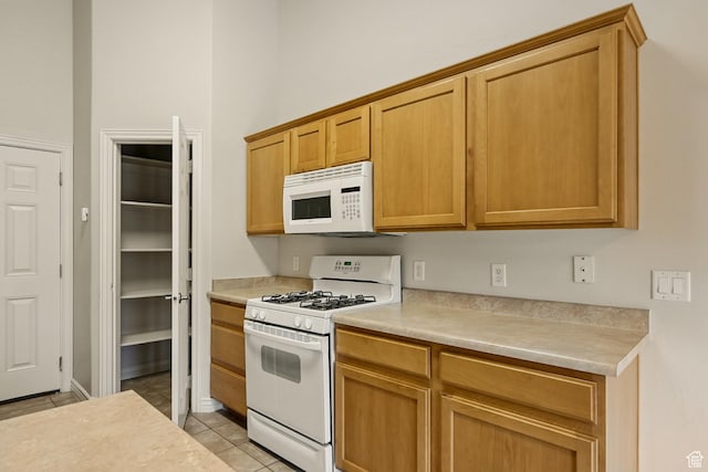 1447 S Southern View Dr, Cedar City, UT 84720 - kitchen with white appliances, light countertops, and light tile patterned floors