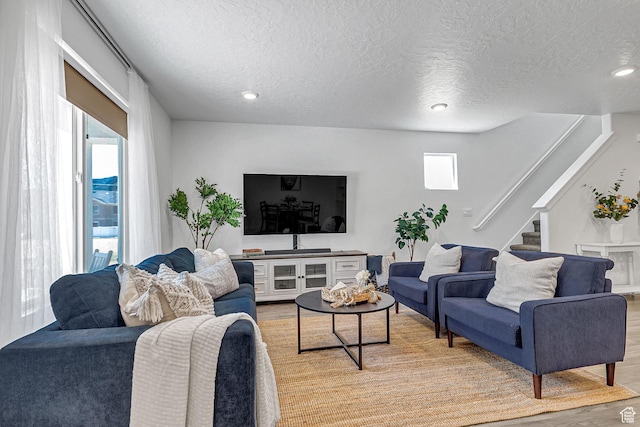 1323 S 3540 E, Spanish Fork, UT 84660 - living room featuring light wood finished floors, a textured ceiling, stairs, and recessed lighting