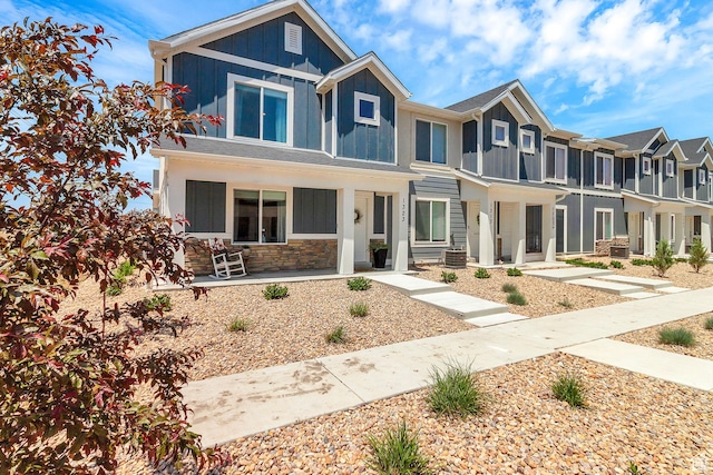 1323 S 3540 E, Spanish Fork, UT 84660 - view of front of property featuring board and batten siding, a porch, stone siding, and a residential view