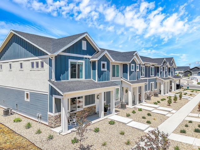 1323 S 3540 E, Spanish Fork, UT 84660 - view of front facade featuring board and batten siding, a residential view, a porch, a shingled roof, and stone siding
