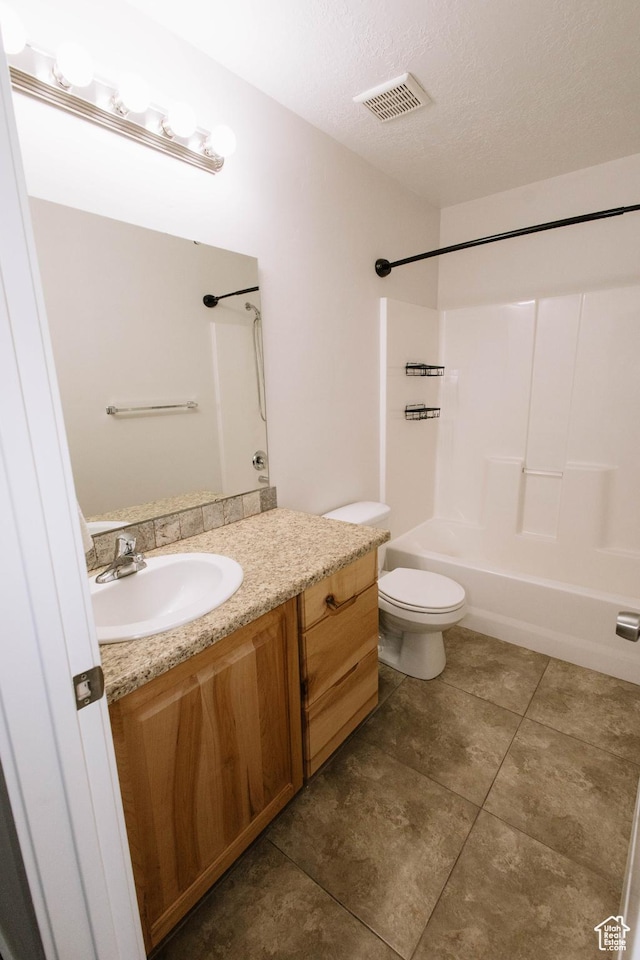 119 W 700 N, Vernal, UT 84078 - full bathroom featuring vanity, shower / tub combination, tile patterned floors, toilet, and a textured ceiling