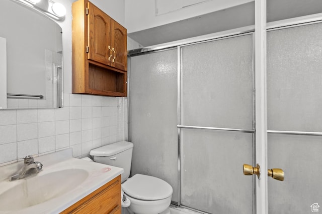 105 N 100 W, Richfield, UT 84701 - bathroom featuring backsplash, vanity, an enclosed shower, toilet, and tile walls