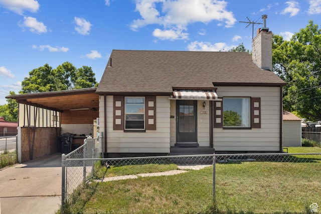 105 N 100 W, Richfield, UT 84701 - view of front facade featuring driveway, an attached carport, a chimney, and a shingled roof