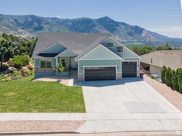 3616 N 600 E, North Ogden, UT 84414 - craftsman-style home featuring board and batten siding, stone siding, driveway, an attached garage, and a front yard