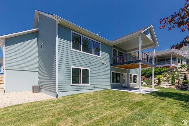 3616 N 600 E, North Ogden, UT 84414 - back of property with a patio, a lawn, a balcony, and central air condition unit