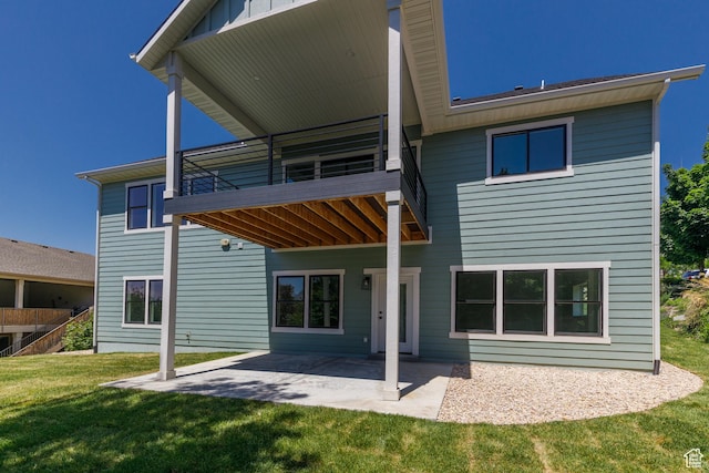 3616 N 600 E, North Ogden, UT 84414 - back of property with a yard, a patio area, and a balcony