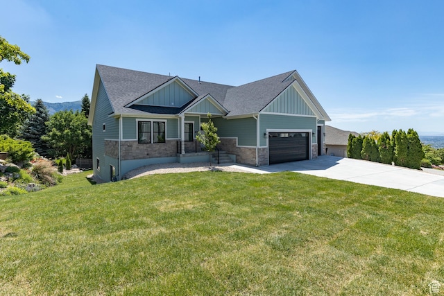 3616 N 600 E, North Ogden, UT 84414 - craftsman-style house featuring board and batten siding, driveway, a front lawn, and an attached garage