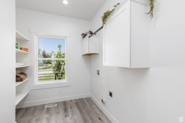 3616 N 600 E, North Ogden, UT 84414 - laundry room with cabinet space, electric dryer hookup, light wood finished floors, washer hookup, and baseboards